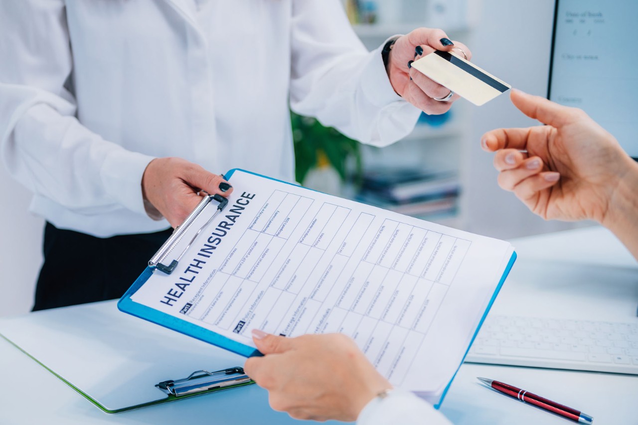 Patient paying health insurance bill with a credit card.